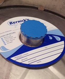 custom printed 2 color keg color on waterproof stock placed on a keg with blue vented keg cap