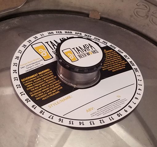 custom printed 2 color keg collar placed on keg with black keg cap and keg cap sticker