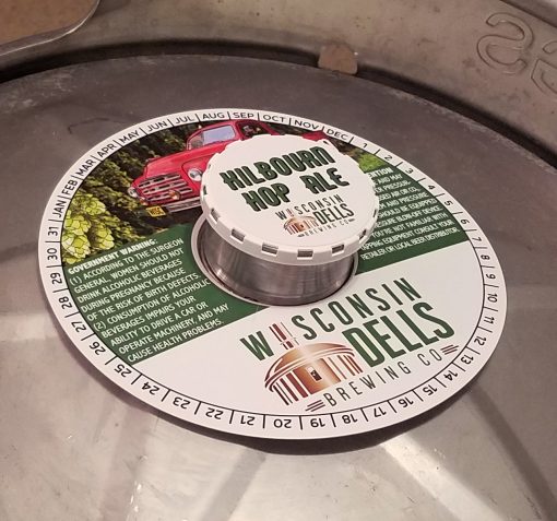 custom printed 4 color digital keg collar placed on a keg with white keg cap and keg cap sticker