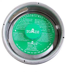 actual printed sample of a 1 color keg collar for Toxic Brewing placed on a sixth barrel